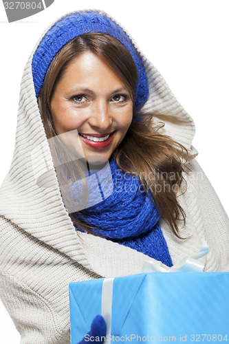 Image of Young woman holding a blue gift