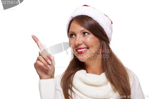 Image of Attractive smiling woman in a Santa hat