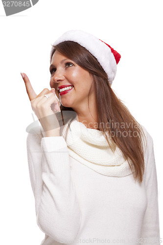 Image of Attractive smiling woman in a Santa hat