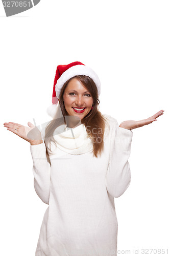 Image of Attractive woman wearing a festive red Santa hat