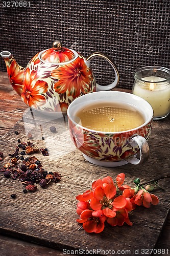 Image of porcelain cup of fragrant tea for medicinal herbs in retro style