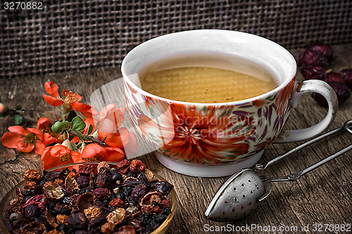 Image of porcelain cup of fragrant tea for medicinal herbs in retro style