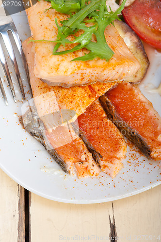 Image of grilled samon filet with vegetables salad