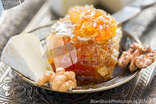 Image of Honey comb, brie and walnuts.