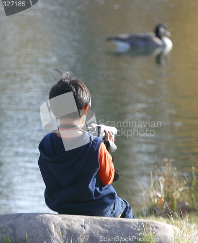 Image of boy with video camera