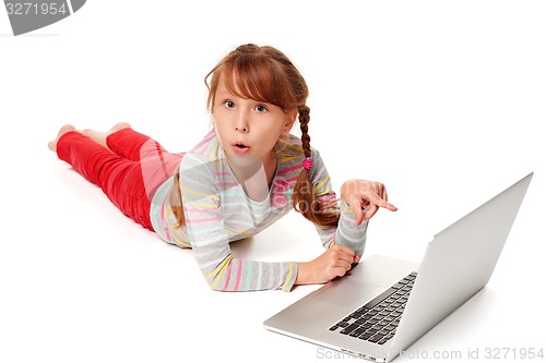 Image of Surprised girl pointing at laptop screen