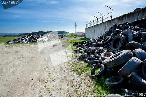 Image of Pile of old tires in farm