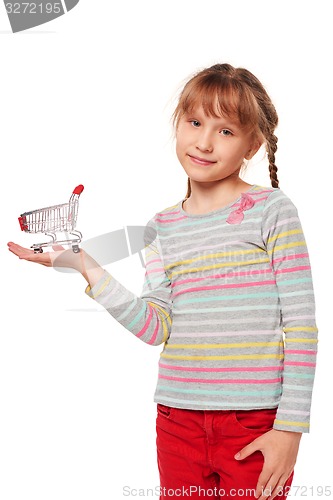 Image of Little girl holding small empty shopping cart