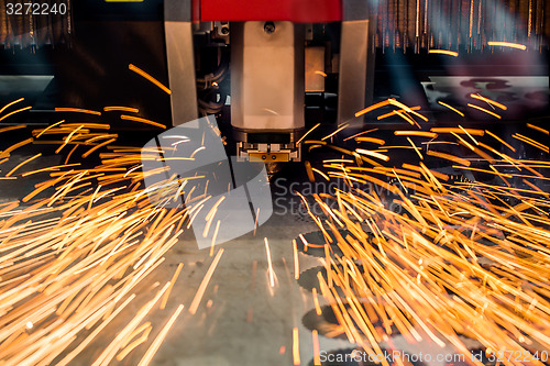 Image of CNC Laser cutting of metal, modern industrial technology.