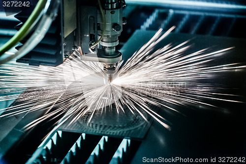 Image of CNC Laser cutting of metal, modern industrial technology.