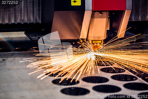 Image of CNC Laser cutting of metal, modern industrial technology.