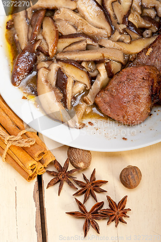 Image of venison deer game filet and wild mushrooms