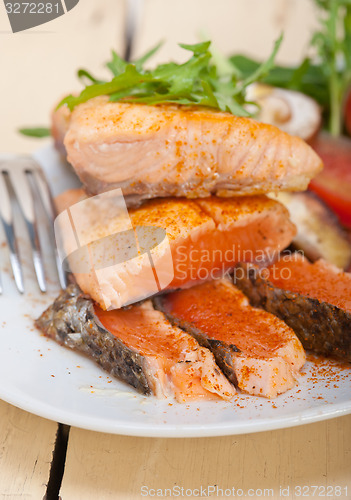 Image of grilled samon filet with vegetables salad