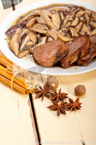 Image of venison deer game filet and wild mushrooms