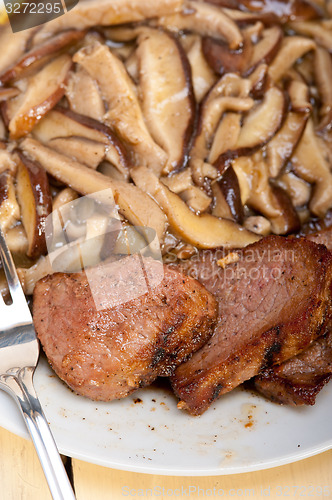 Image of venison deer game filet and wild mushrooms