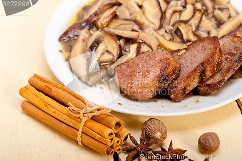 Image of venison deer game filet and wild mushrooms