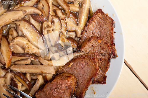 Image of venison deer game filet and wild mushrooms