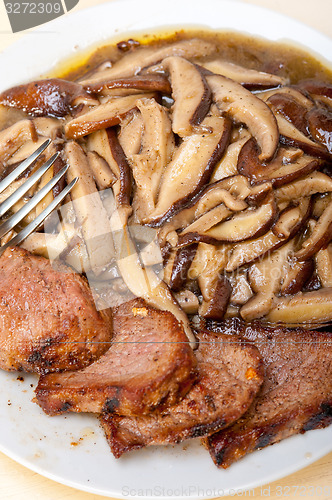 Image of venison deer game filet and wild mushrooms