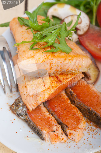 Image of grilled samon filet with vegetables salad