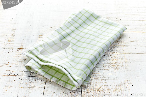 Image of cotton napkin on white wooden table