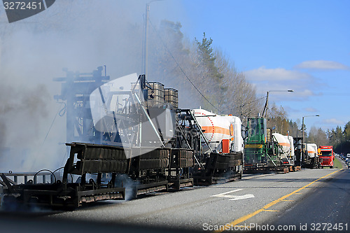 Image of Machine Laying Asphalt Concrete at Roadworks