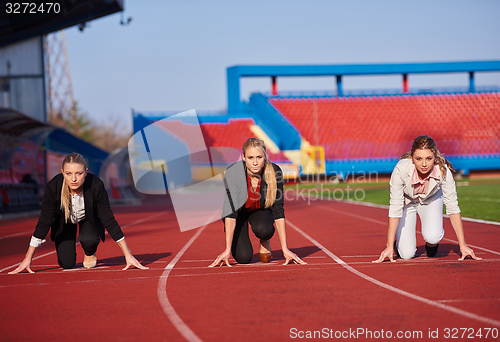 Image of business woman ready to sprint