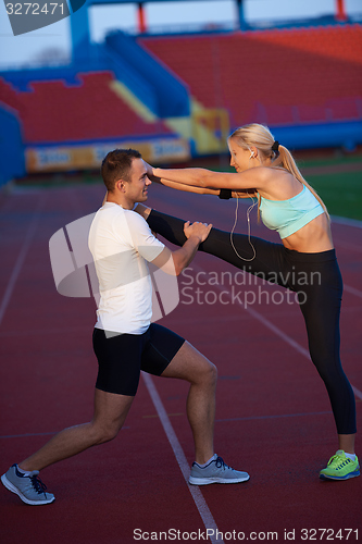 Image of sporty woman on athletic race track