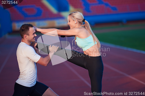Image of sporty woman on athletic race track