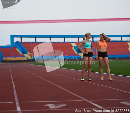 Image of Female Runners Finishing Race Together