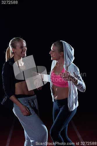 Image of sporty woman on athletic race track