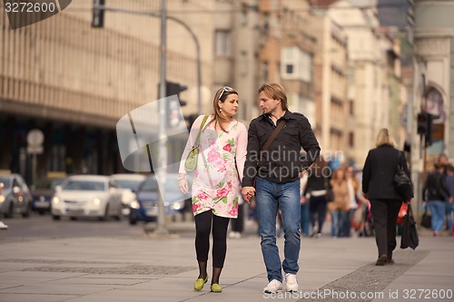 Image of young pregnant couple have fun and relax
