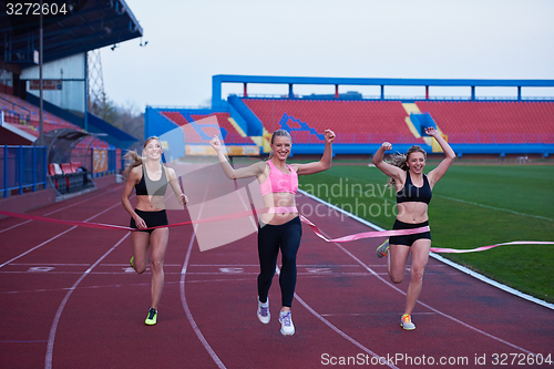 Image of Female Runners Finishing Race Together