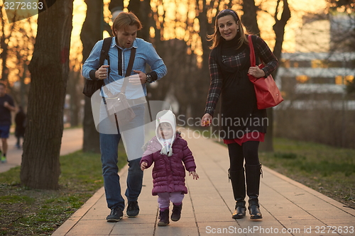 Image of young pregnant couple have fun and relax