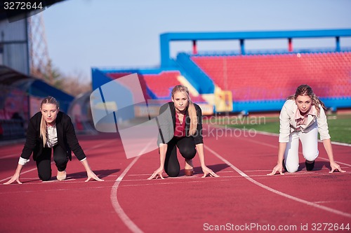 Image of business woman ready to sprint