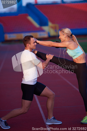 Image of sporty woman on athletic race track
