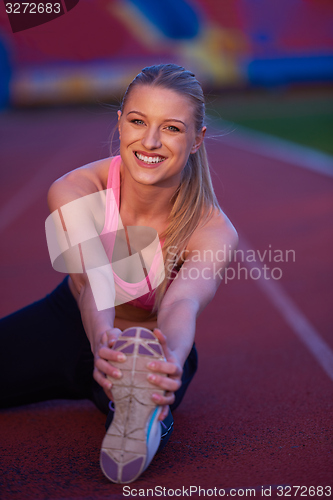 Image of sporty woman on athletic race track