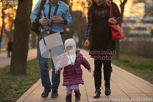 Image of young pregnant couple have fun and relax