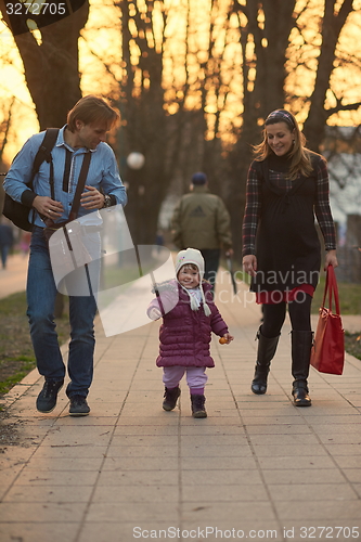 Image of young pregnant couple have fun and relax