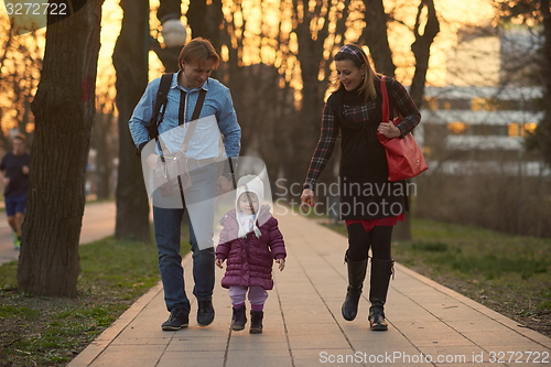 Image of young pregnant couple have fun and relax
