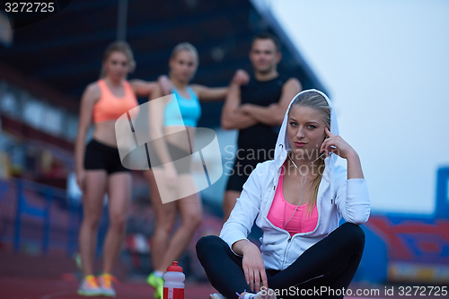 Image of sporty woman on athletic race track
