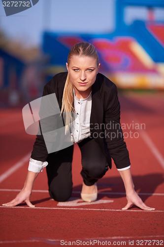 Image of business woman ready to sprint