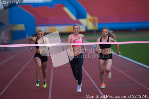 Image of Female Runners Finishing Race Together