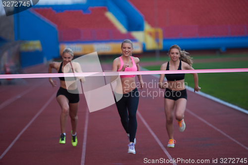 Image of Female Runners Finishing Race Together