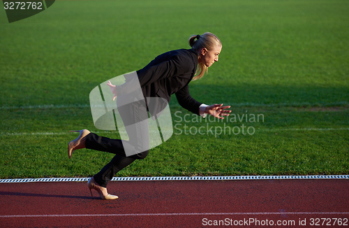 Image of business woman ready to sprint