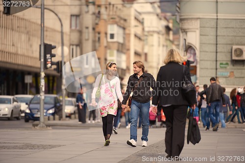 Image of young pregnant couple have fun and relax