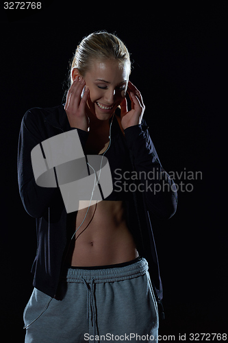 Image of sporty woman on athletic race track