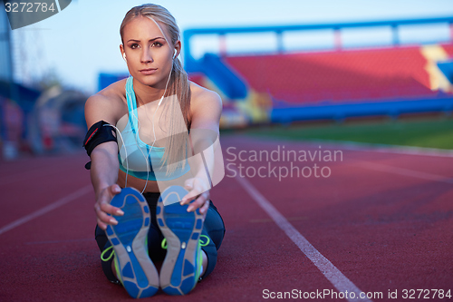 Image of sporty woman on athletic race track