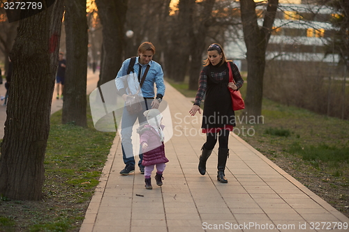 Image of young pregnant couple have fun and relax