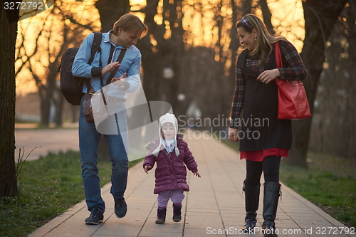 Image of young pregnant couple have fun and relax