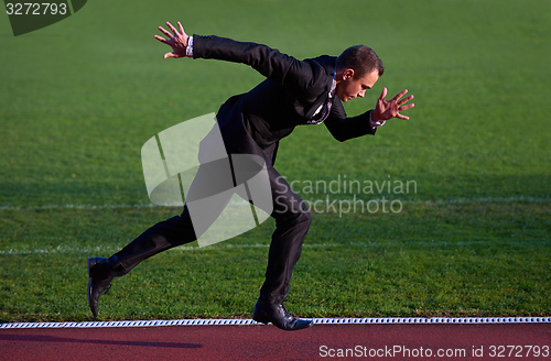 Image of business man ready to sprint